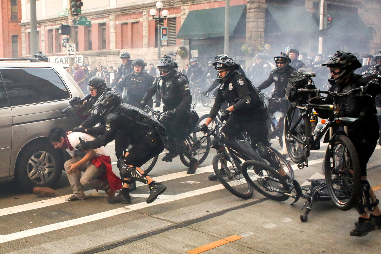 Police officers detain a protester during anti-capitalist protests following May Day marches in Seattle, Washington, U.S. May 1, 2016. REUTERS/David Ryder     TPX IMAGES OF THE DAY      - RTX2CDO2